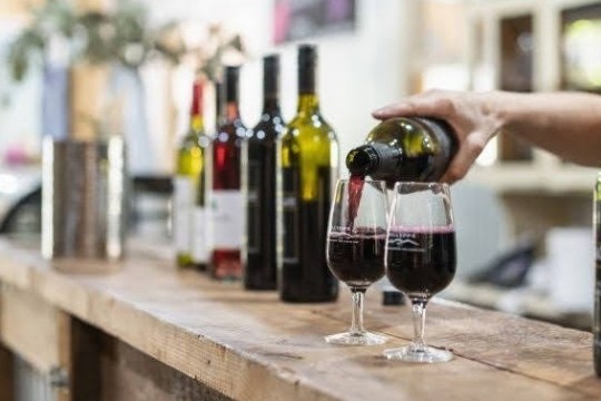 a bottle and a glass of wine