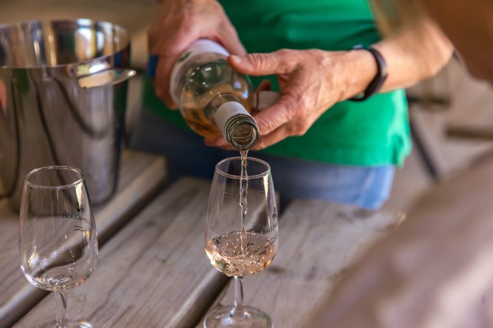 a man holding a glass of wine